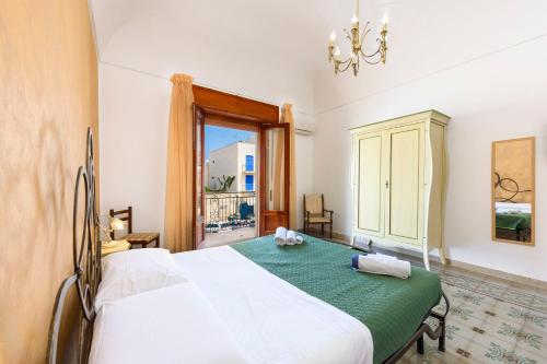 En eller flere senge i et værelse på I Tre Golfi - Appartamenti a 300 mt dal mare