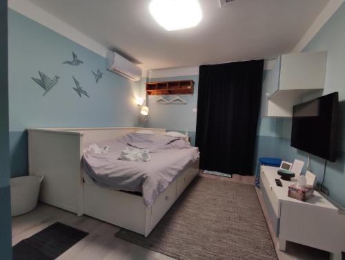 Postel nebo postele na pokoji v ubytování Levélke Mini Apartman