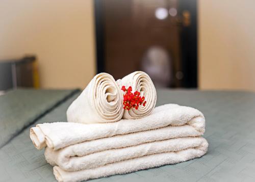 a pile of towels sitting on a table at Atlantic Bay Resort, Prampram in Prampram