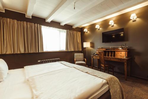 Postel nebo postele na pokoji v ubytování Promenade Hotel Liepaja