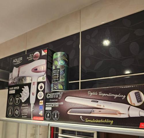 a shelf with toothbrushes and cans on it at Apartment in Zyrardow 10min to Suntago in Żyrardów