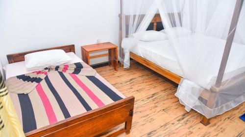 Postel nebo postele na pokoji v ubytování Nature Royal Resort