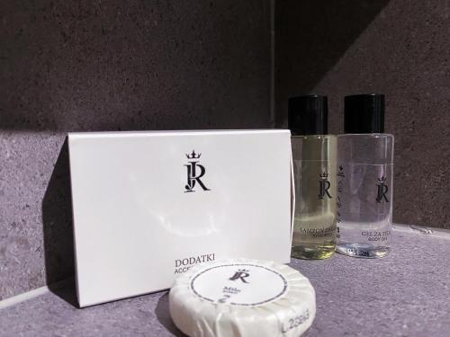 a white box with three bottles of perfume on a counter at JR Piran B&B in Piran