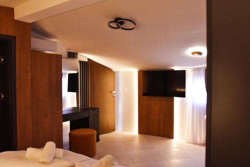 a bedroom with a bed and a ceiling fan at JR Piran B&B in Piran