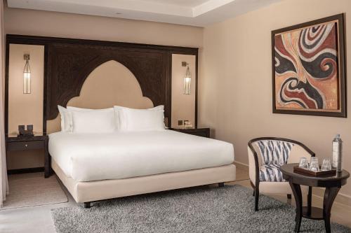 Postel nebo postele na pokoji v ubytování Grand Plaza Marrakech