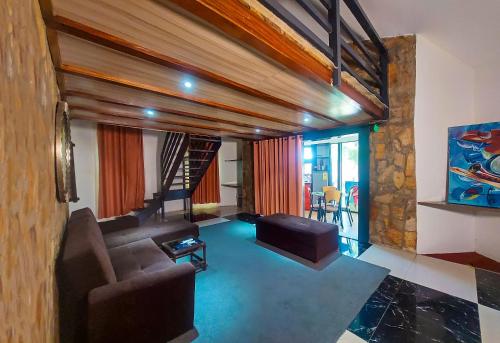 a living room with a couch and a table at Atlantic Bay Resort, Prampram in Prampram
