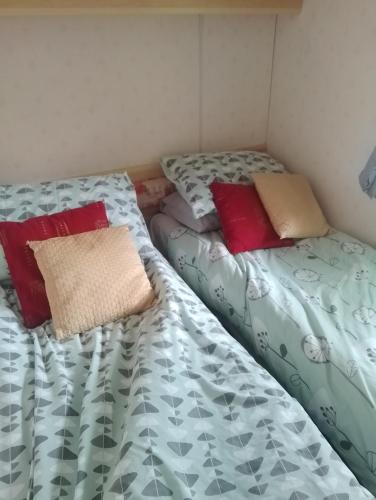 two beds sitting next to each other in a room at Country retreat one in Gisburn