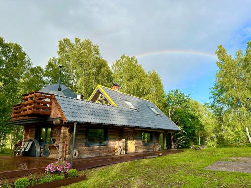 a log cabin with a dome on top of it at Lepikumäe Holiday Home with Sauna and Hot tub for up to 18 persons in Reina