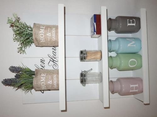 a bathroom with a door with four water bottles at Holiday Home Scout by Interhome in Machtlos