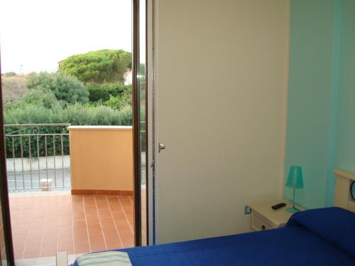 Кровать или кровати в номере Guest House Mare e Luna