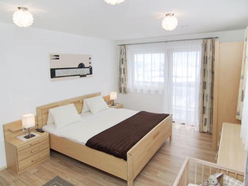 a bedroom with a large bed in a room at Holiday Home Schiestl by Interhome in Ramsau
