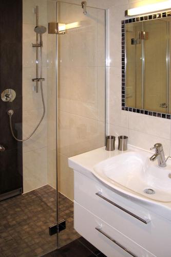 a bathroom with a sink and a shower at Holiday Home Schiestl by Interhome in Ramsau