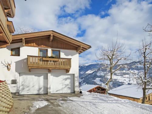 a house with a balcony on top of a mountain at Holiday Home Margit by Interhome in Hippach