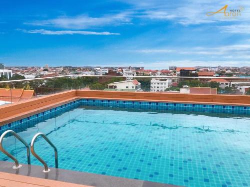 a large swimming pool on top of a building at Aaron Hotel in Vientiane