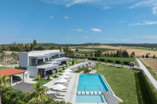 an aerial view of a villa with a swimming pool at Sani Gulf I & II in Sani Beach