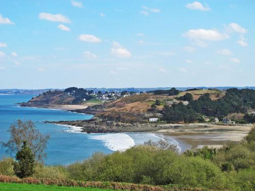 a view of a beach with the ocean at Holiday Home La Belle Vue by Interhome in Locquirec