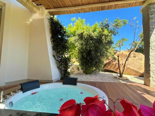 a jacuzzi tub in a house with a view at Corte Bianca - Adults Only & SPA - Bovis Hotels in Cardedu