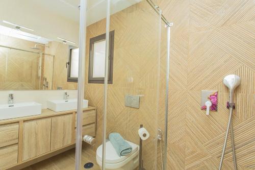 a bathroom with a shower with a toilet and a sink at 129 Luxury Relax La Mata-Alicante Holiday in La Mata