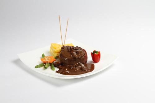 a plate of chocolate dessert on a white plate at Hotel Ajavi in Ibarra