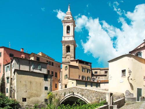 an old building with a clock tower in a city at Apartment Asplanato - DOL166 by Interhome in Lecchiore