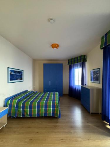 Postel nebo postele na pokoji v ubytování Villa Nettuno Residence