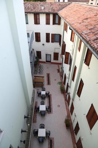 an overhead view of a courtyard in a building at Hotel Mantegna Stazione, MantegnaHotels in Mantova