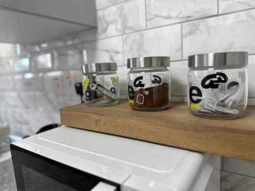 a shelf with two jars withigeriger at Nıcosıa lefkosa brand new renovated 1 bedroom 3A in Yenişehir