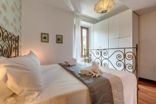 Ένα ή περισσότερα κρεβάτια σε δωμάτιο στο Malavolta Apartment by Mamo Florence