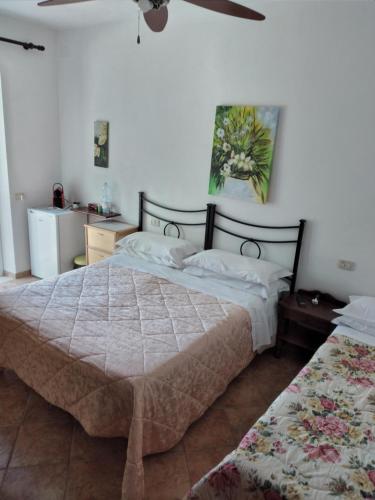 Postel nebo postele na pokoji v ubytování Agriturismo I Due Pini