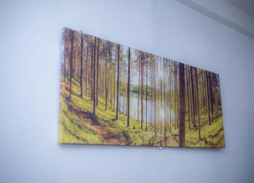 a painting of a forest with a lake at Home Away from Home - Gowon Estate near Gemade, Ipaja, Lagos in Lagos