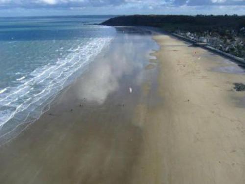 an aerial view of a beach with the ocean at Ty Pierre in Plérin