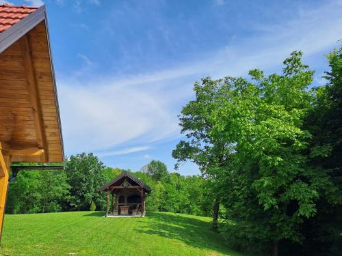 a gazebo in the middle of a grass field at Bakina iža in Duga Resa