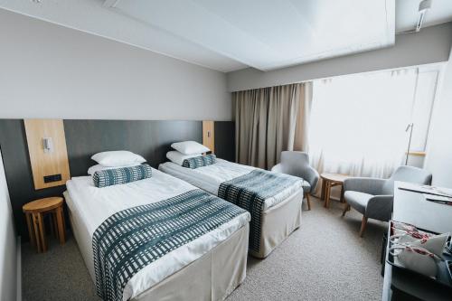 Ένα ή περισσότερα κρεβάτια σε δωμάτιο στο Original Sokos Hotel Alexandra Jyväskylä
