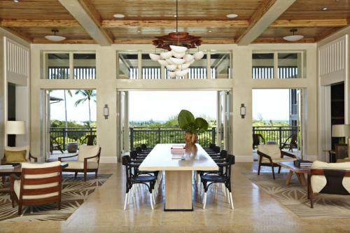 a dining room with a table and chairs at The Island House in Nassau