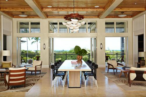 a dining room with a table and chairs at The Island House in Nassau