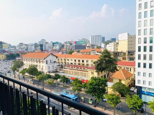 a view of a city from a balcony at Liberty 2 Hotel in Ho Chi Minh City