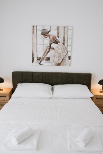 Ένα ή περισσότερα κρεβάτια σε δωμάτιο στο Apartman Fidelis