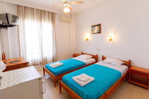 Postel nebo postele na pokoji v ubytování Dimitrouli rooms