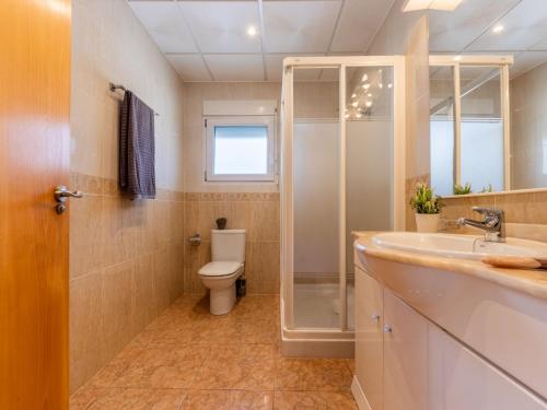 a bathroom with a toilet and a shower and a sink at Holiday Home Dani by Interhome in L'Eucaliptus