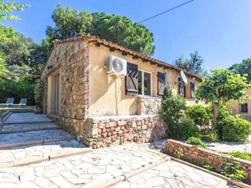 a small stone house with a stone driveway at Holiday Home Casa Germaine by Interhome in Porto-Vecchio