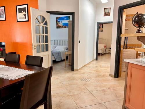 a kitchen and a dining room with a table at Seamply apartment il mare in 1 minuto in Maiori