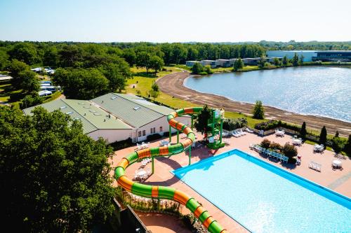 an aerial view of a water park with a water slide at Glamping de Schatberg in Sevenum
