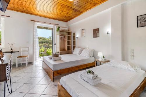 Ένα ή περισσότερα κρεβάτια σε δωμάτιο στο Kerkis Traditional Guesthouse