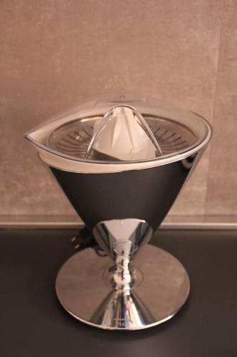 a silver hourglass sitting on top of a table at Appartamento Le Palmine in Cento