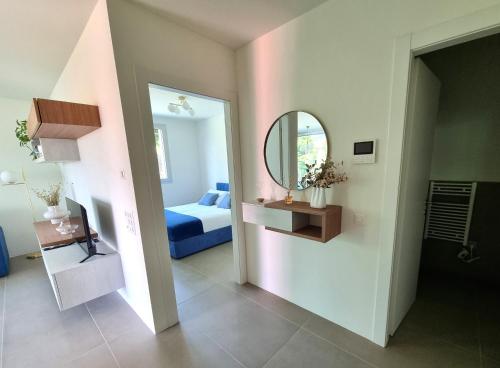 a room with a bedroom with a mirror and a bed at Kristal Gabri in Lugano