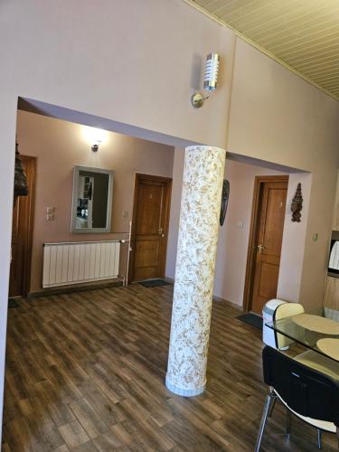 a living room with a large column in the middle at Villa Szófia in Siófok