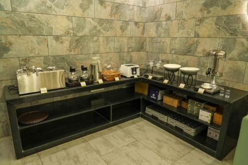 O bucătărie sau chicinetă la Hotel El Lujo