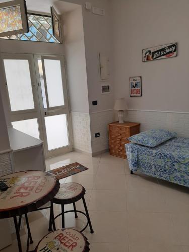 A bed or beds in a room at Dimora Stabiae