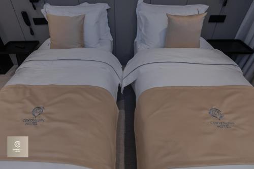 Letto o letti in una camera di Central Inn Hotel