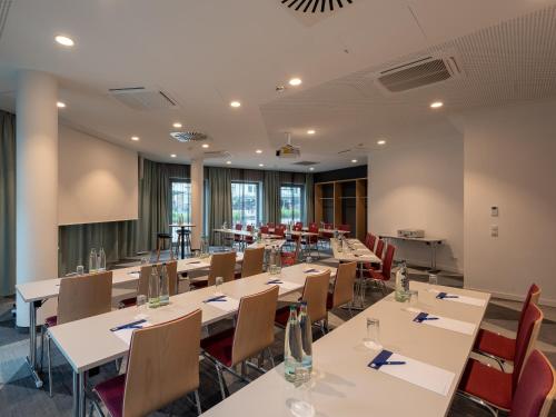 a large conference room with tables and chairs at Holiday Inn Express Heilbronn by IHG in Heilbronn